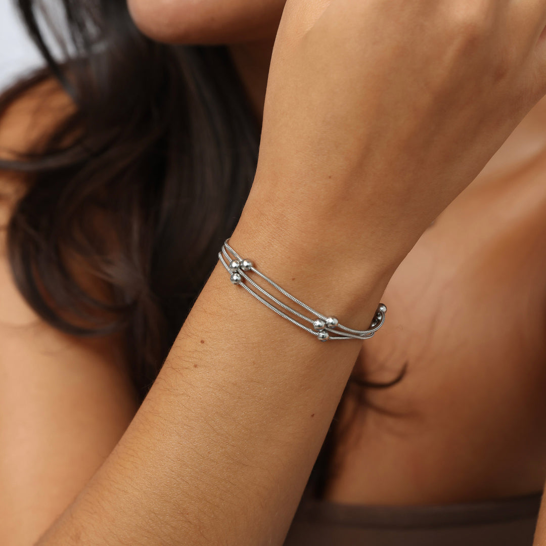 Oda - Braccialetto a più fili con perline in acciaio inox