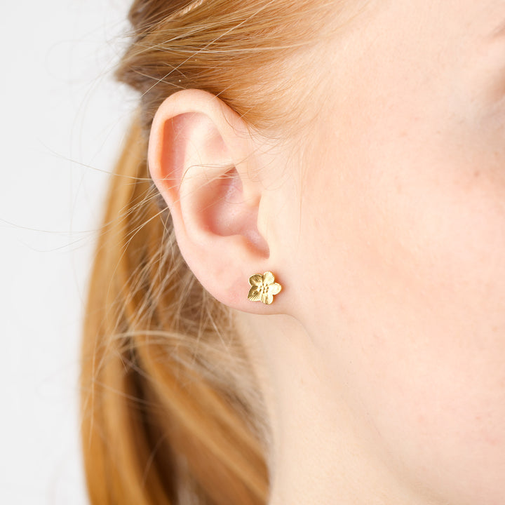 Sadia - Orecchini a bottone a fiore in acciaio inox